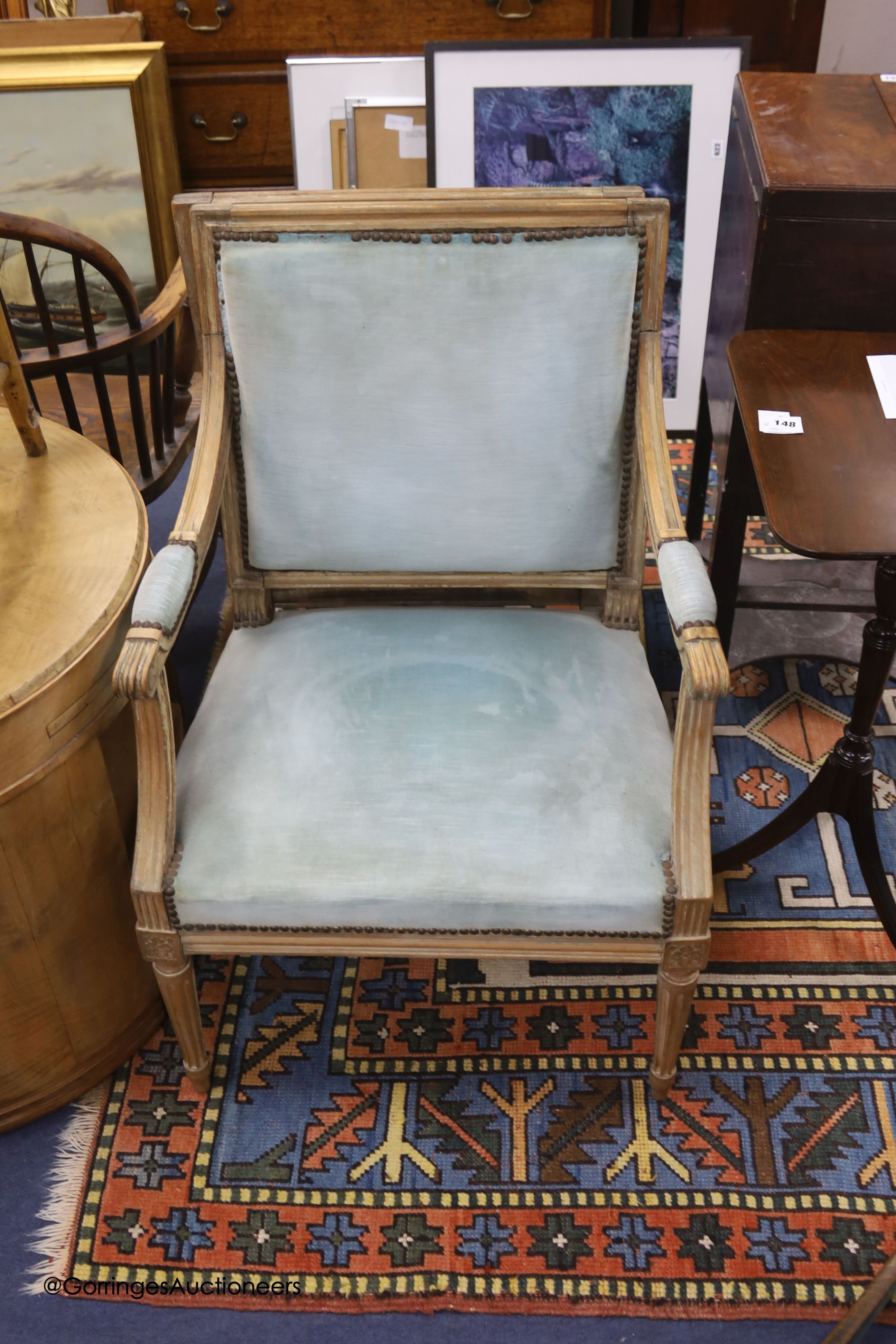 A pair of Louis XVI style beech elbow chairs, fluted frames